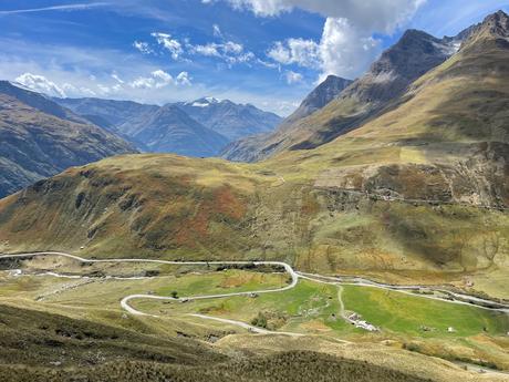 Dramatic mountains and a lush green valley in Parc National de la Vanoise in the French Alps