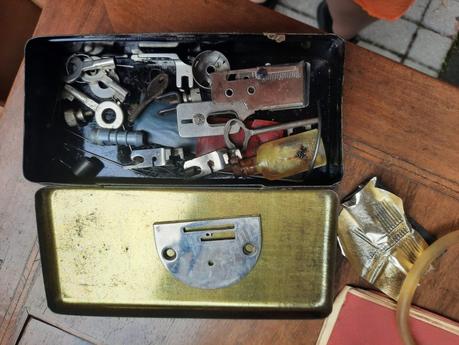 The box of attachments and accessories we found in the drawer of our vintage Vesta Dietrich sewing machine