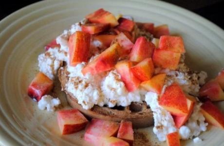 Whole wheat waffle topped with cottage cheese, fresh fruit, and cinnamon