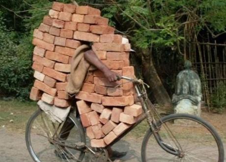 Bicycle Overloaded With Bricks