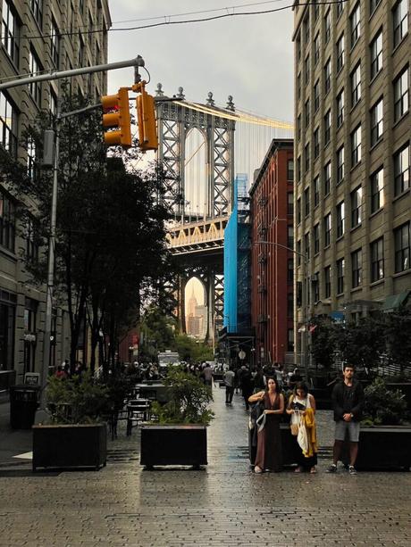 Iconic view of the Manhattan bridge framed by buildings in DUMBO Brooklyn