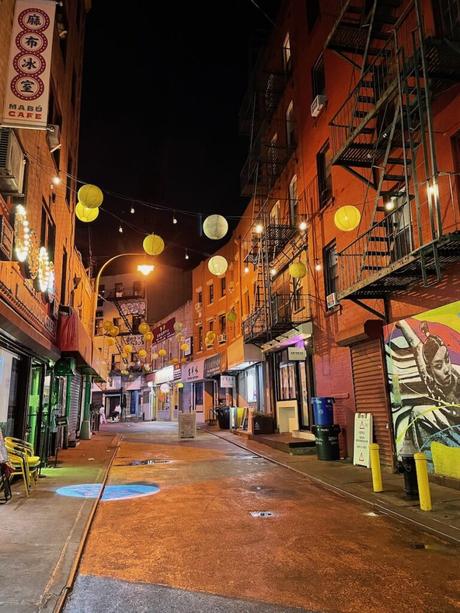 Doyers Street in Chinatown with Chinese lanterns and a colourful mural on the wall