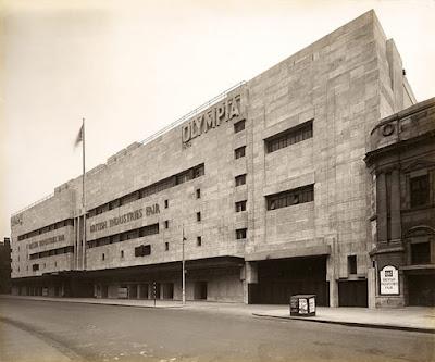 The Portland stone façade of Joseph Emberton's magnificent 1929 building at Olympia is slathered in paint