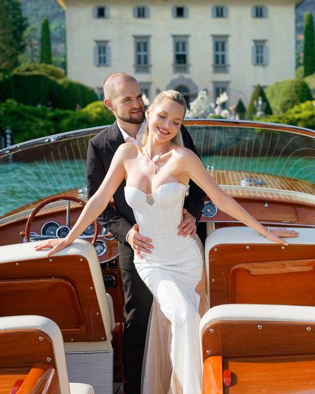 angelina and vladyslavs wedding newlyweds posing at the boat