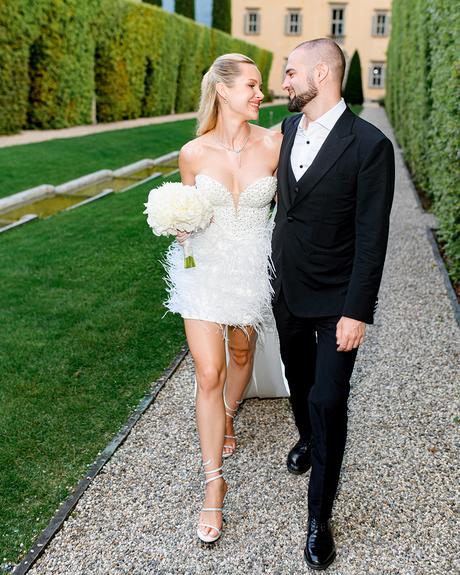 angelina and vladyslavs wedding newlyweds walking at villa backyard