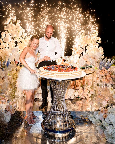 angelina and vladyslavs wedding bride and groom cutting italian wedding cake