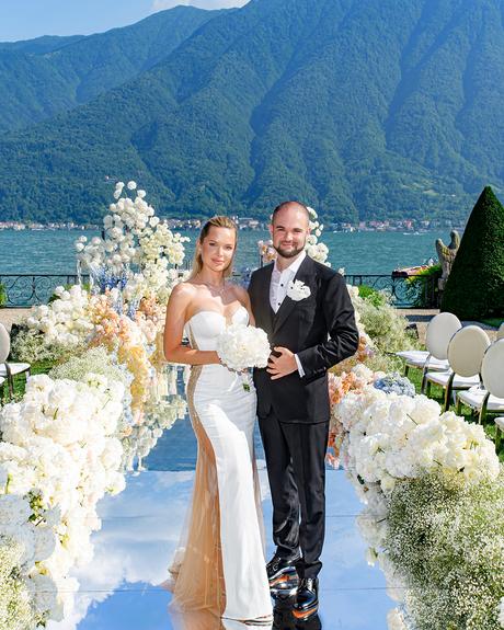 angelina and vladyslavs wedding newlyweds posing at wedding aisle