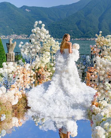 angelina and vladyslavs wedding bride posing back photo floral aisle