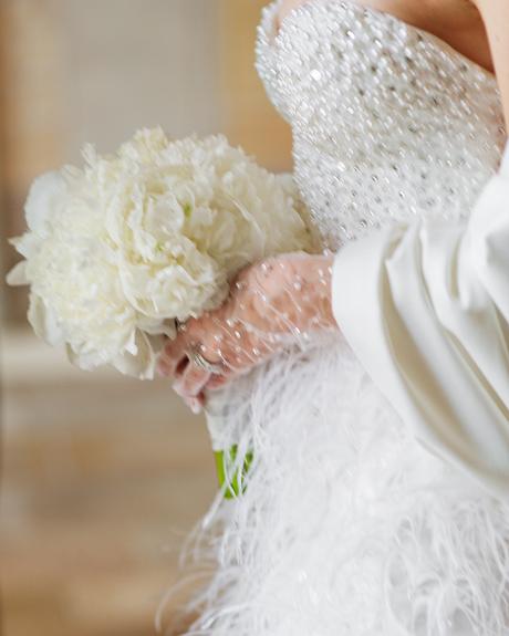 angelina and vladyslavs wedding bride holding white wedding bouquet