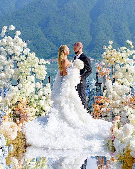 angelina and vladyslavs wedding newlyweds posing at wedding aisle flower decor