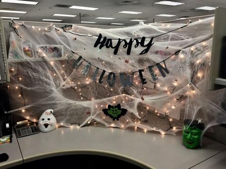 Cheesecloth and string lights with Halloween props