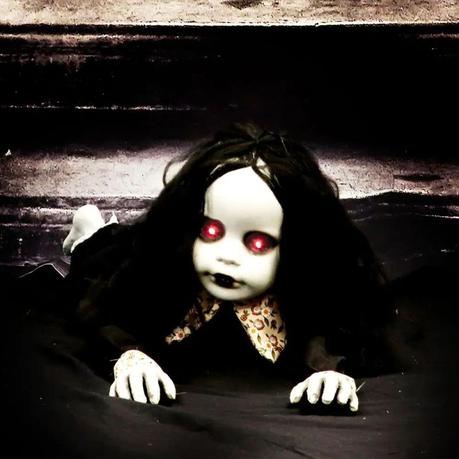 This battery operated creepy doll has red flashing eyes, animated crawling-like motion and speaks two phrases