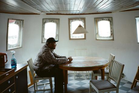 On ‘The Bear,’ Ramy Youssef Found Stillness in Copenhagen Image may contain Architecture Building Dining Room Dining Table Furniture Indoors Room Table Lamp Wood and Chair