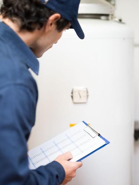 plumber checking a boiler