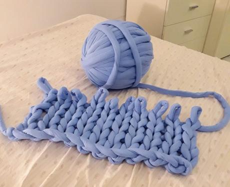 The knitting (or is it better called weaving?) of our giant yarn blanket