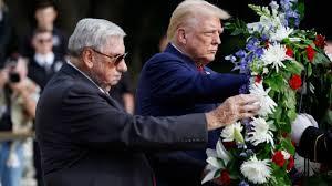 Trump and his campaign staffers place a wreath at Arlington National Cemetery and wind up in a fracas with a cemetery official over possible rules violations