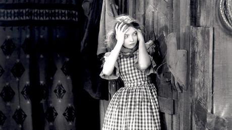 Lillian Gish holding her head in The Wind.