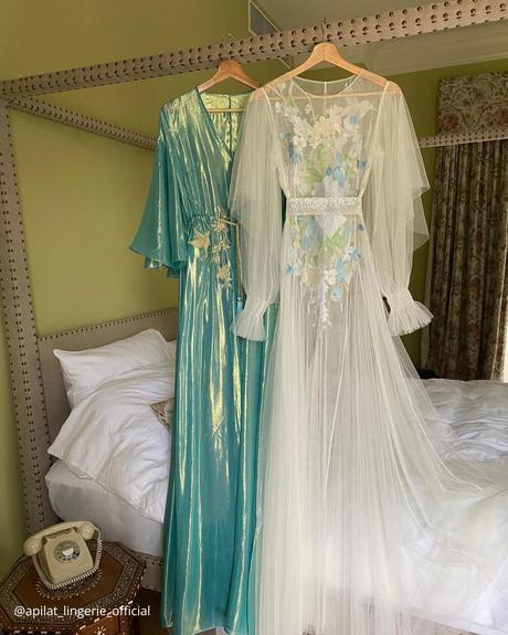 where to buy a wedding dress blue and white shiny dresses hanging on hangers decorated with floral decor