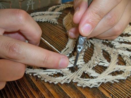 Locutus using the hollow punch for leather for string art weaving