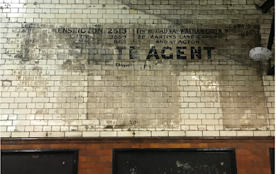 Estate Agent ghostsign at Fulham Broadway Station.