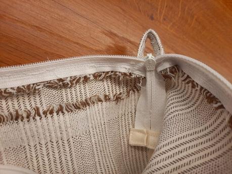 The main panels of my embroidery project travel bag sewn together, detail of the zipper