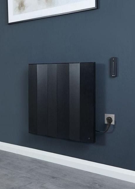 milano notus black electric wall heater on a navy wall