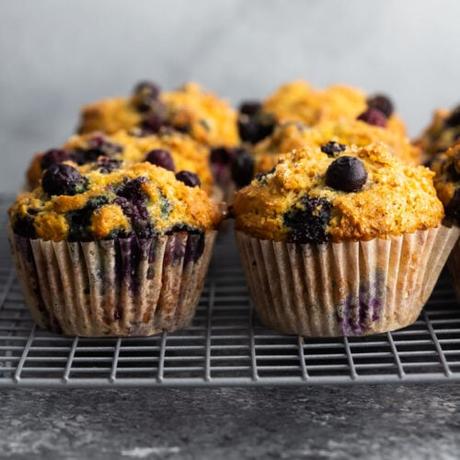 side angle view of blueberry muffins on wire rack