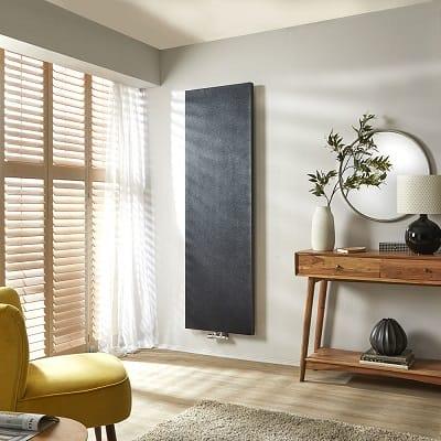 Milano Riso flat panel designer radiator in a modern room near a window