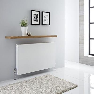 A white Milano Mono convector radiator in a modern room