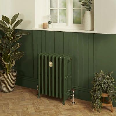 a green cast iron radiator painted in farrow and ball green 