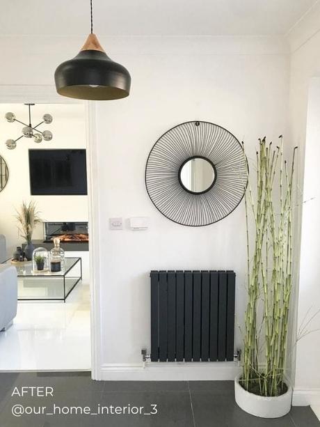 anthracite horizontal designer radiator on white wall in a hallway