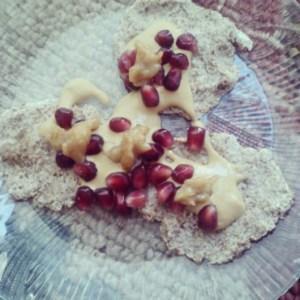 Raw flax pancakes topped with Sunwarrior protein sauce, pomegranate and date syrup. 