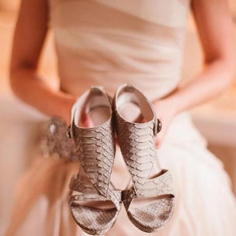 Wedding shoes with bride in background