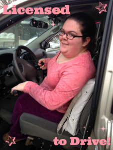 Emily in pink shirt and purple pants behind the wheel of an adaptive van. Pink text reads 