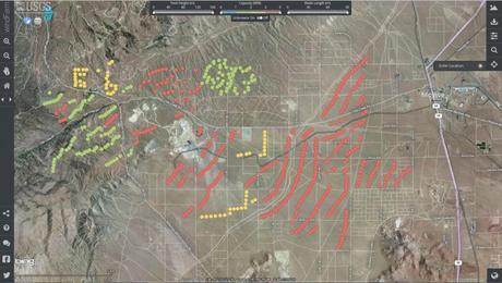 A screenshot of the USGS WindFarm Mapping Application, which allows users to access the more than 47,000 individual wind turbines contained within the national wind turbine database. This view shows facilities in Southern California, color-coded for their wind-generating capacity. The red and yellow turbines have a higher electricity-generating capacity than the green and blue turbines do. Click the map to get started!