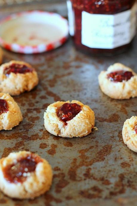 Jam Thumbprint Cookies that are gluten-free, vegan, refined sugar-free and can be made paleo. With only four ingredients, these are so easy & so delicious! | From Bakerita.com
