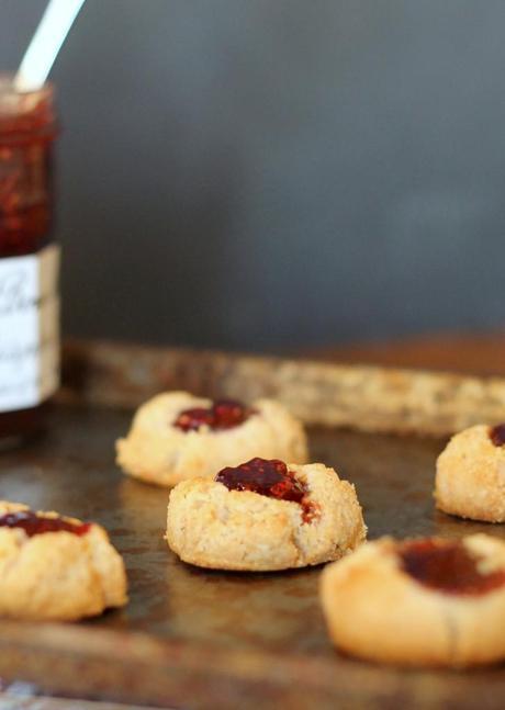 Jam Thumbprint Cookies that are gluten-free, vegan, refined sugar-free and can be made paleo. With only four ingredients, these are so easy & so delicious! | From Bakerita.com