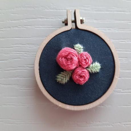 Embroidered rose pendant