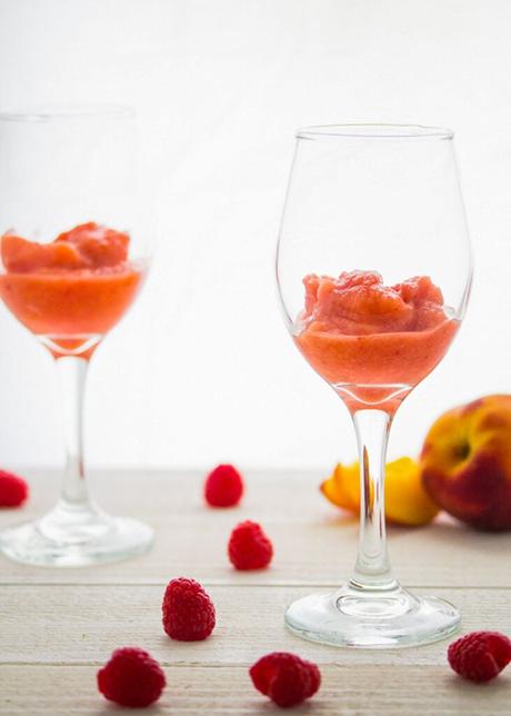 peach slush in the bottom of a glass