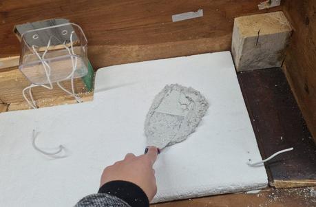 A Nativity diorama inside an antique steamer trunk (part 2, crafting the terrain) Making the landscape for our Christmas nativity diorama inside the steamer trunk: the cement coating