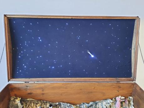 A Nativity diorama inside an antique steamer trunk (part 2, crafting the terrain) Detail of the lid of our restored steamer trunk, with stars and comet