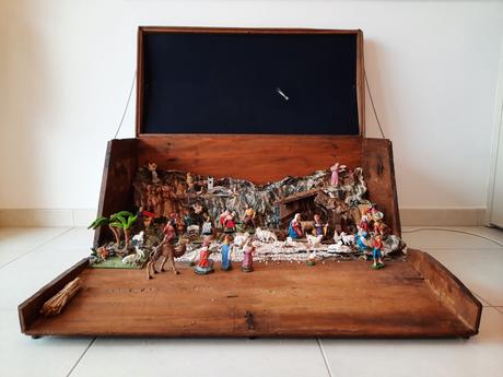 A Nativity diorama inside an antique steamer trunk (part 2, crafting the terrain) Restored steamer trunk with Nativity scene diorama, open with statues