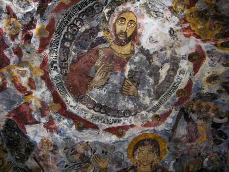 Close-up of a colorful fresco featuring the image of Jesus Christ surrounded by angels and biblical figures, located in the Sumela Monastery.