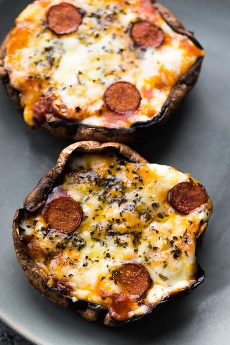 a close up of baked stuffed mushrooms