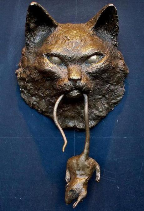 Hunting cat inspired door knocker