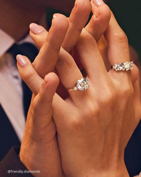 The Heart of an Ethical Promise: More Than Just a Ring ethical engagement rings two hands with moissanite center stone rings friendly.diamonds