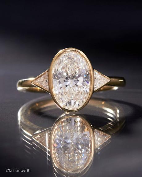 The Heart of an Ethical Promise: More Than Just a Ring ethical engagement rings oval cut yellow gold ring brilliantearth