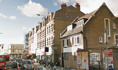 Who is removing the old metal Telephone and Telegraph signs?