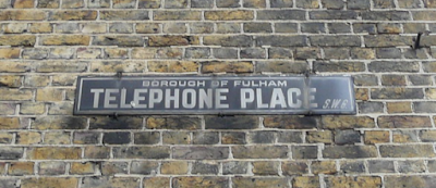 Who is removing the old metal Telephone and Telegraph signs?