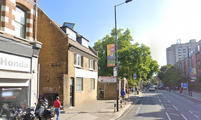Who is removing the old metal Telephone and Telegraph signs?